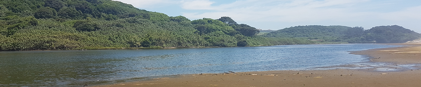 Photograph of a coastal, river view on a sandy beach in South Africa