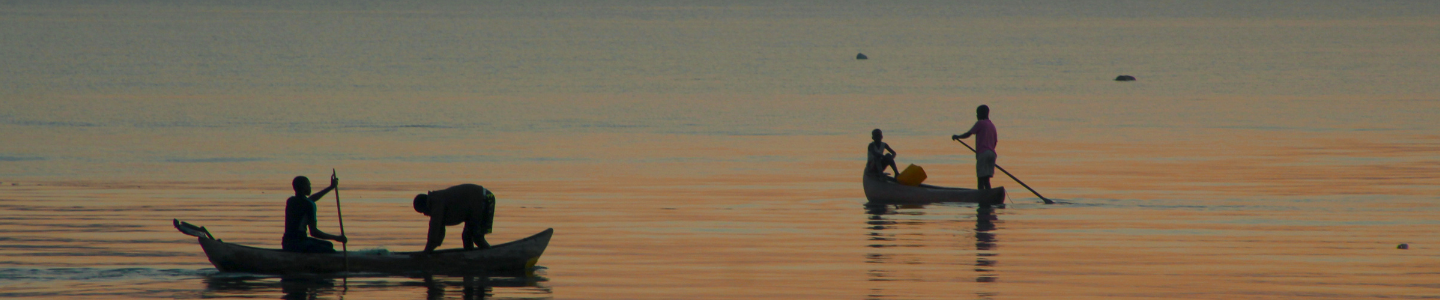 Two fisher boats on a lake at dusk